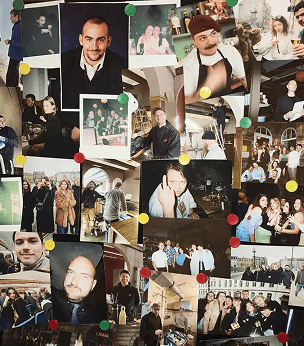 bunch of polaroids of the workteam on a fridge